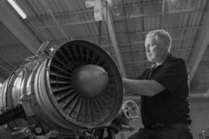 Employee working on jet engine at Vector Aerospace, Summerside, PEI.